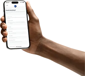 Person holding iPhone showing the Return2Owner Found something? report form